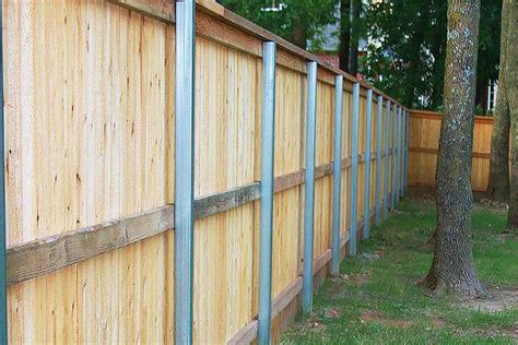 Wrapping steel posts with wood when building wood fence